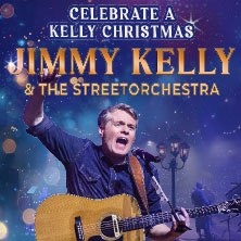 Jimmy Kelly mit Gitarre vor weihnachtlichem Hintergrund. Text: "Celebrate a Kelly Christmas! Jimmy Kelly & The Streetorchestra"., &copy; links im Bild