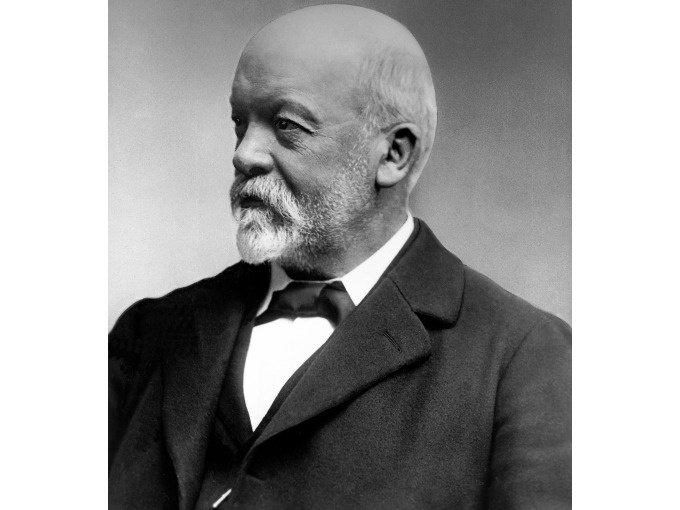 Ein historisches Porträt eines älteren Mannes mit Bart und Glatze, der zur Seite schaut. Er trägt einen Anzug und hat einen nachdenklichen Ausdruck., © Eigenbetrieb Tourismus und Citymanagement Schorndorf