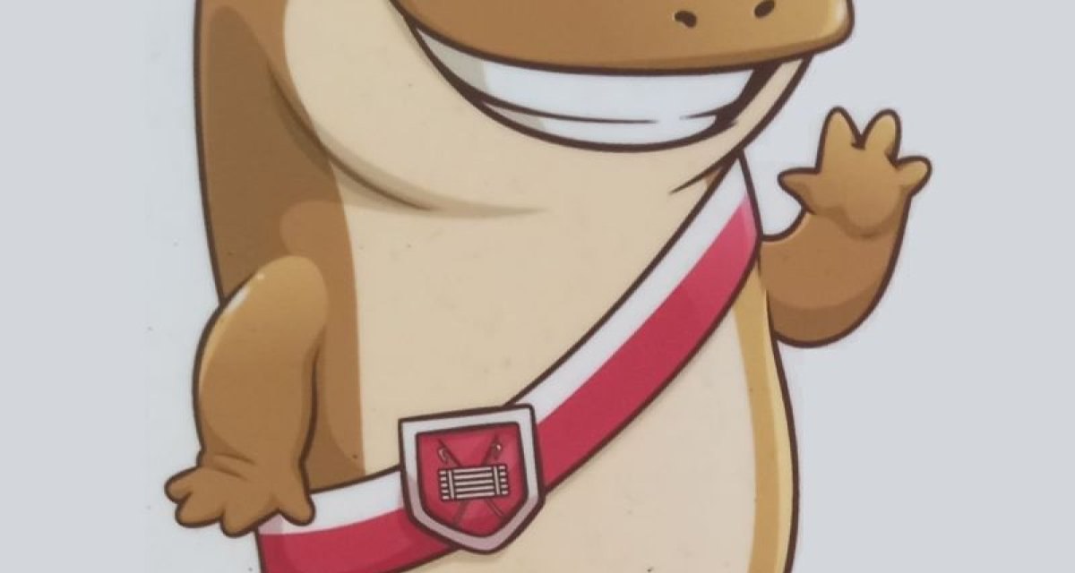 Ein lächelndes, cartoonartiges Tier mit großen Augen, rotem Band und Wappen, das freundlich winkt. Ein lächelndes, cartoonartiges Tier mit großen Augen, rotem Band und Wappen, das freundlich winkt.