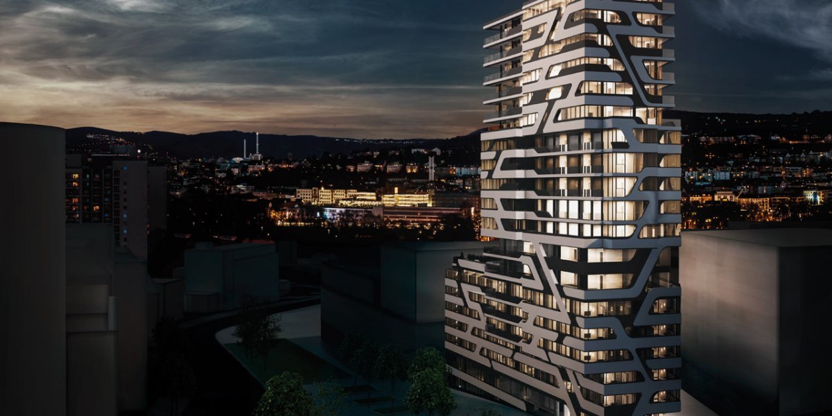 Ein modernes Hochhaus mit einzigartigem Design bei Nacht, beleuchtet, mit einer Stadtlandschaft im Hintergrund., © Jaz Hotel Stuttgart