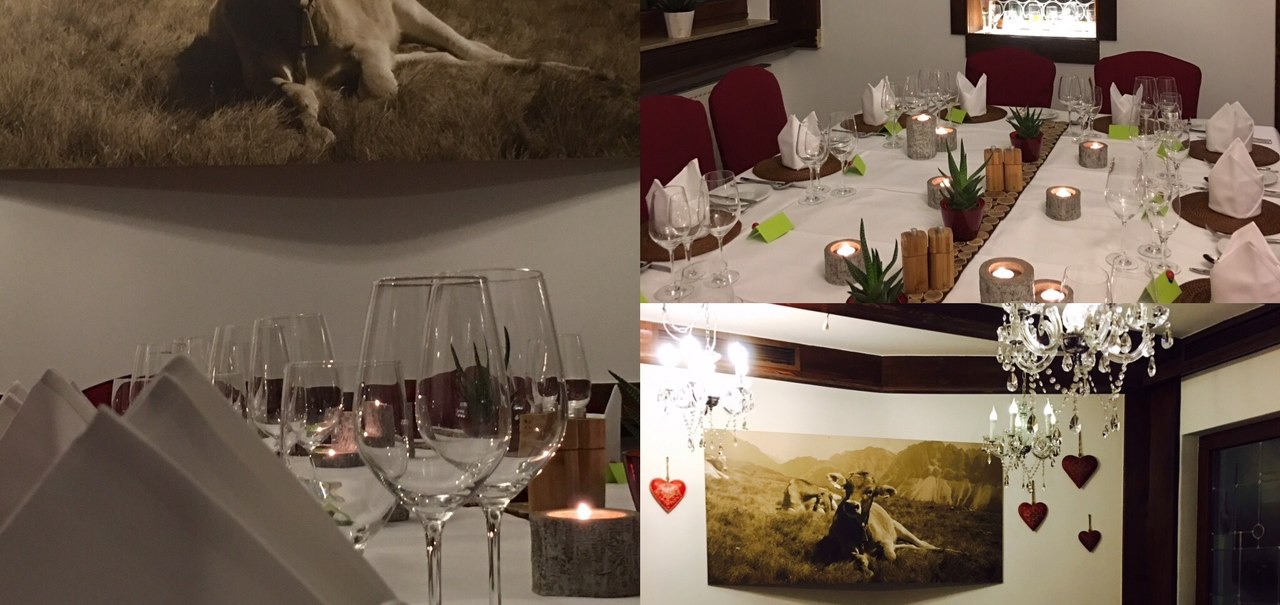 Elegantes Restaurant mit gedecktem Tisch, Weingläsern und Kerzen. An der Wand hängt ein Bild von Kühen in den Bergen., © TOMAS Elegantes Restaurant mit gedecktem Tisch, Weingläsern und Kerzen. An der Wand hängt ein Bild von Kühen in den Bergen., © TOMAS